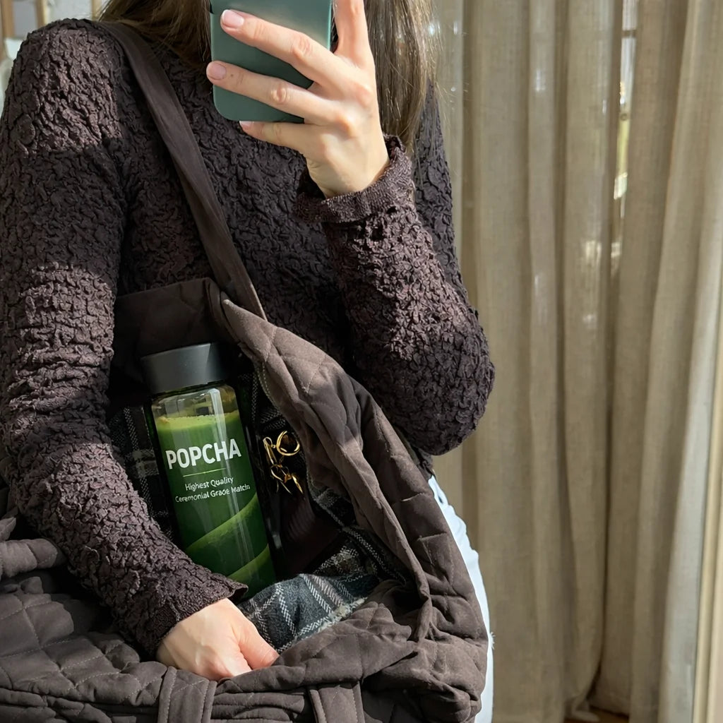 Popcha matcha bottle in a bag carried by a girl